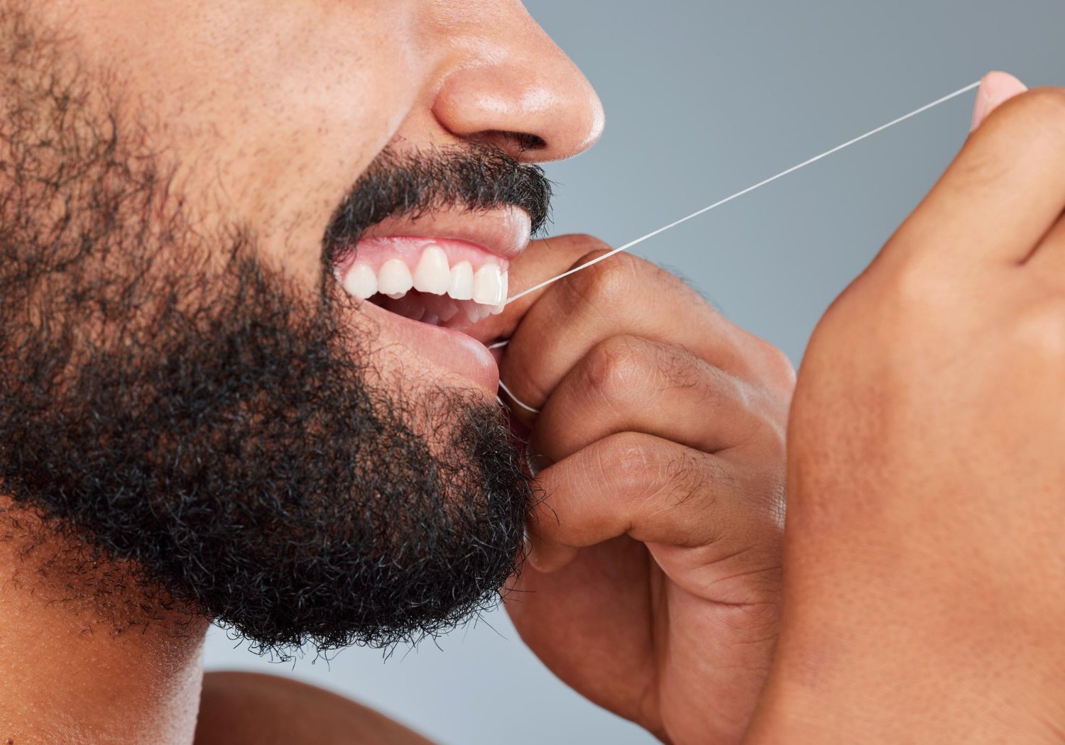 man flossing